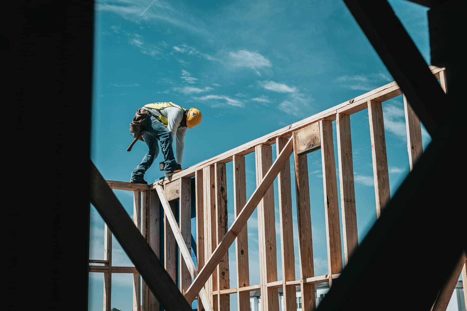 a construction worker working on a frame